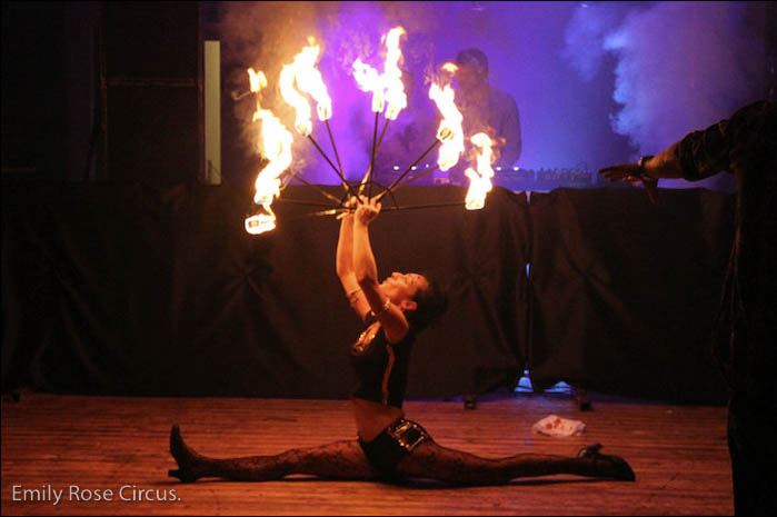 Emily Rose performs with fire fans